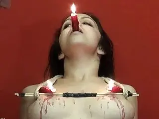 Brunette slave's nipples are roughly tortured while she gets waxed