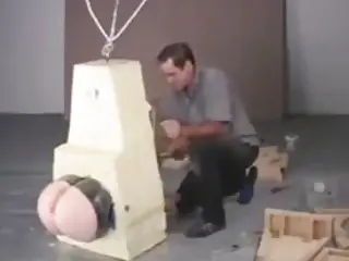 BDSM encased slave tortured with only his big ass free