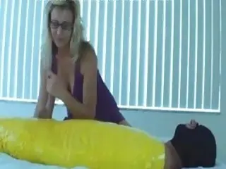 Sadistic mistress take full advantage of her mummified slave BDSM
